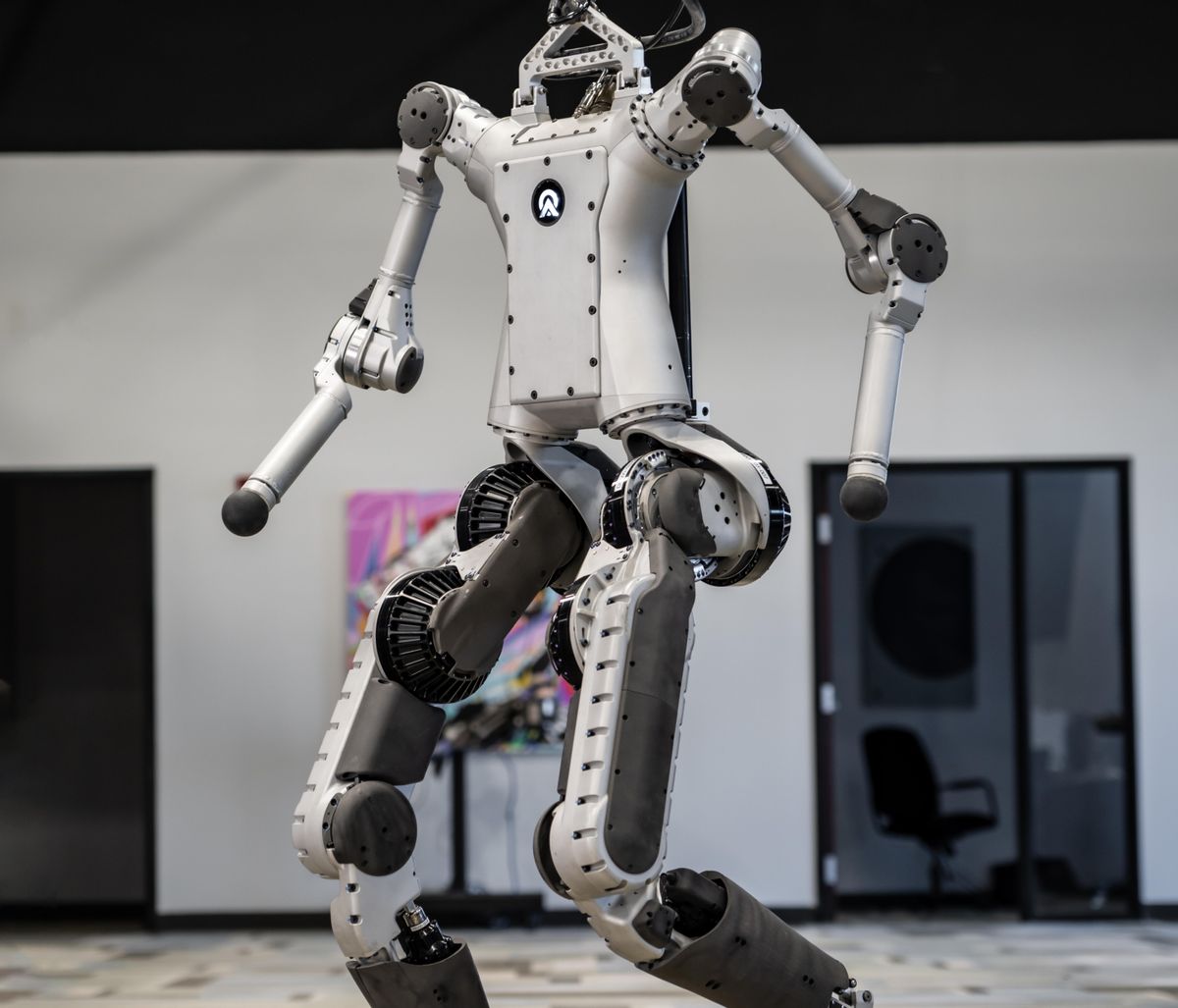 A photo of a sliver and black humanoid robot