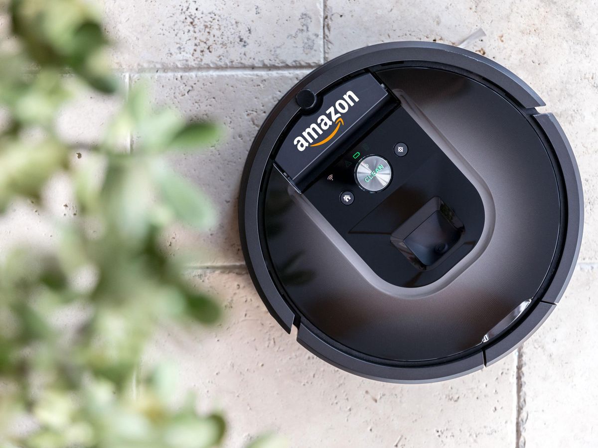 A photo of an iRobot Roomba with an Amazon logo digitally added to it