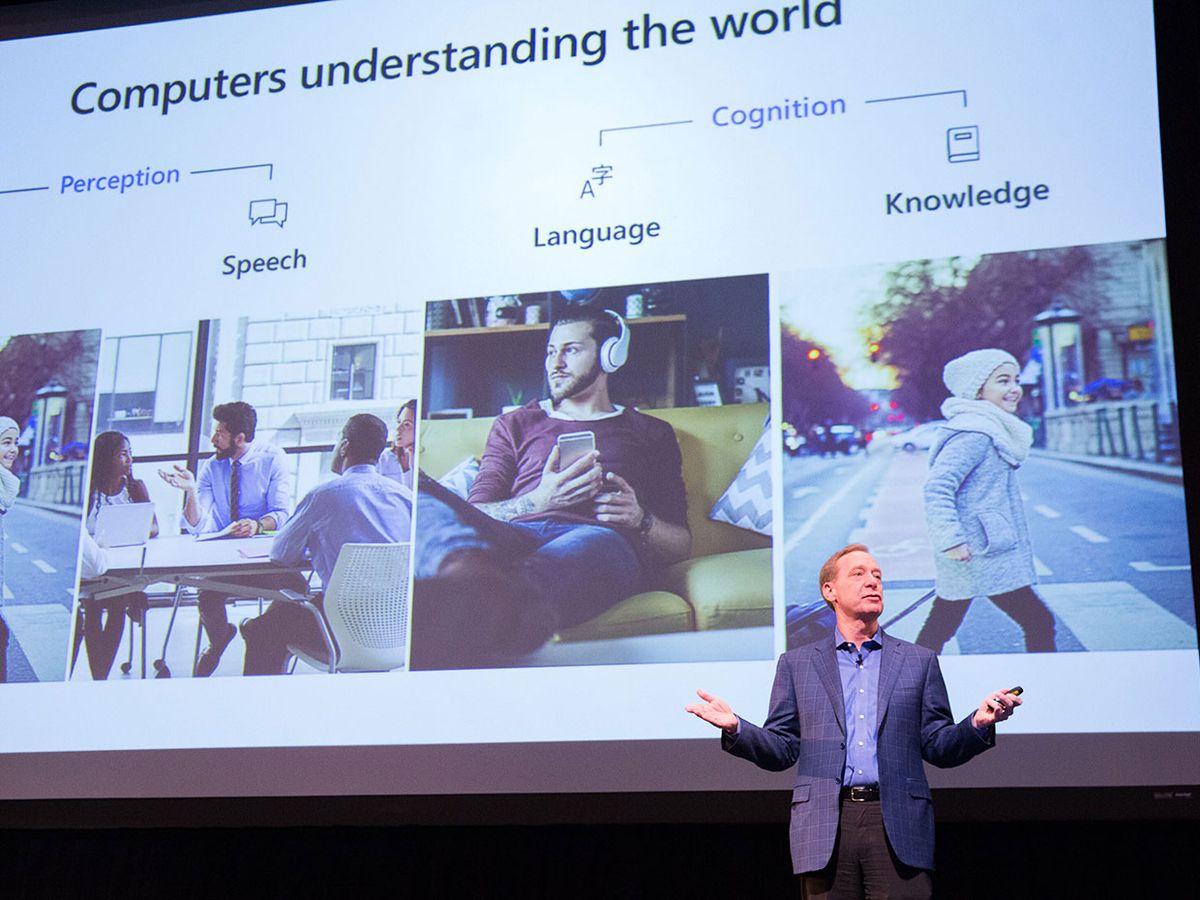 A photo of Brad Smith of Microsoft speaking on stage at Columbia University