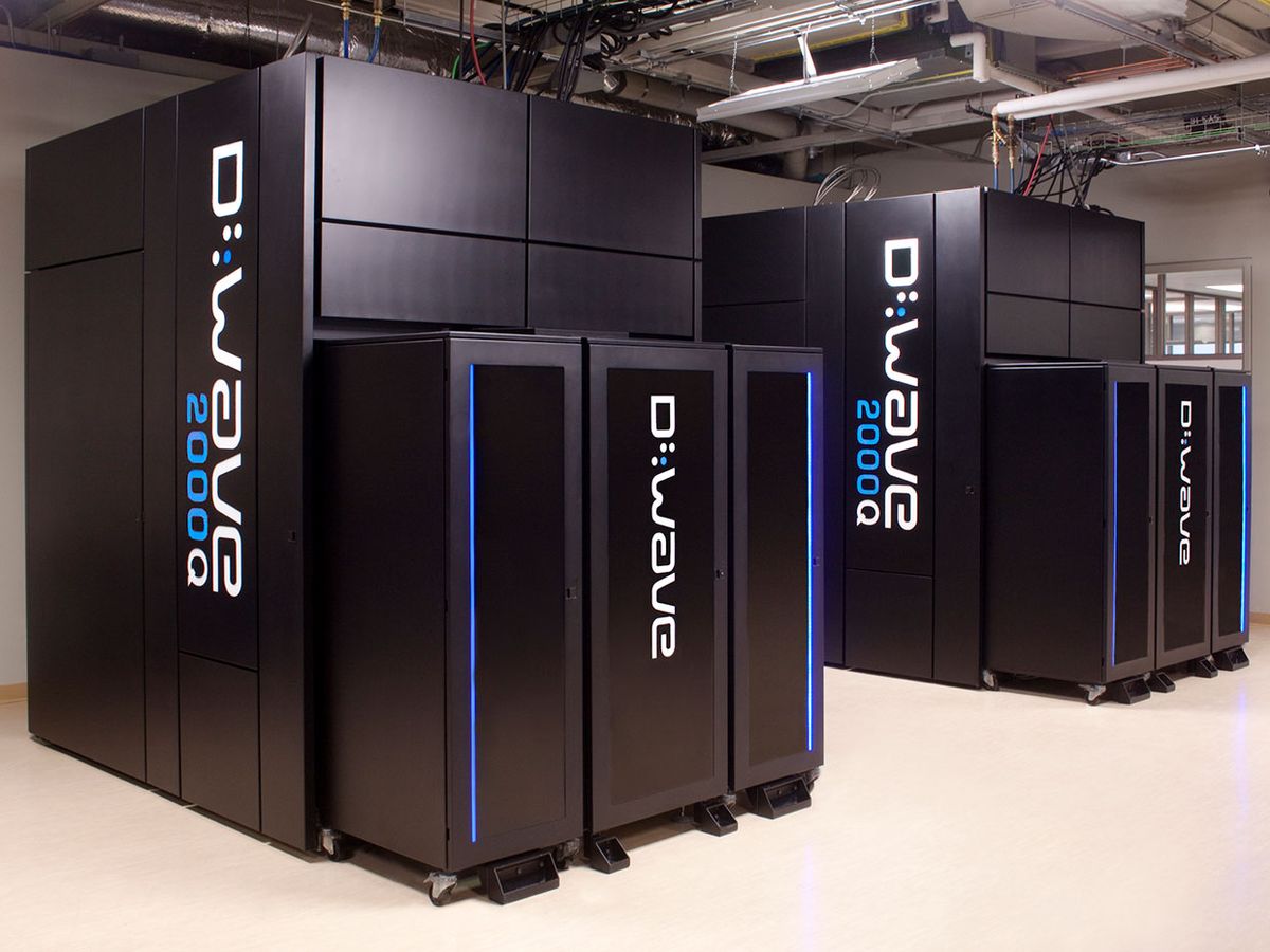 A photo of the D-Wave 2000Q which looks like large black boxes emblazoned with the D-Wave name in white, arranged in a room.