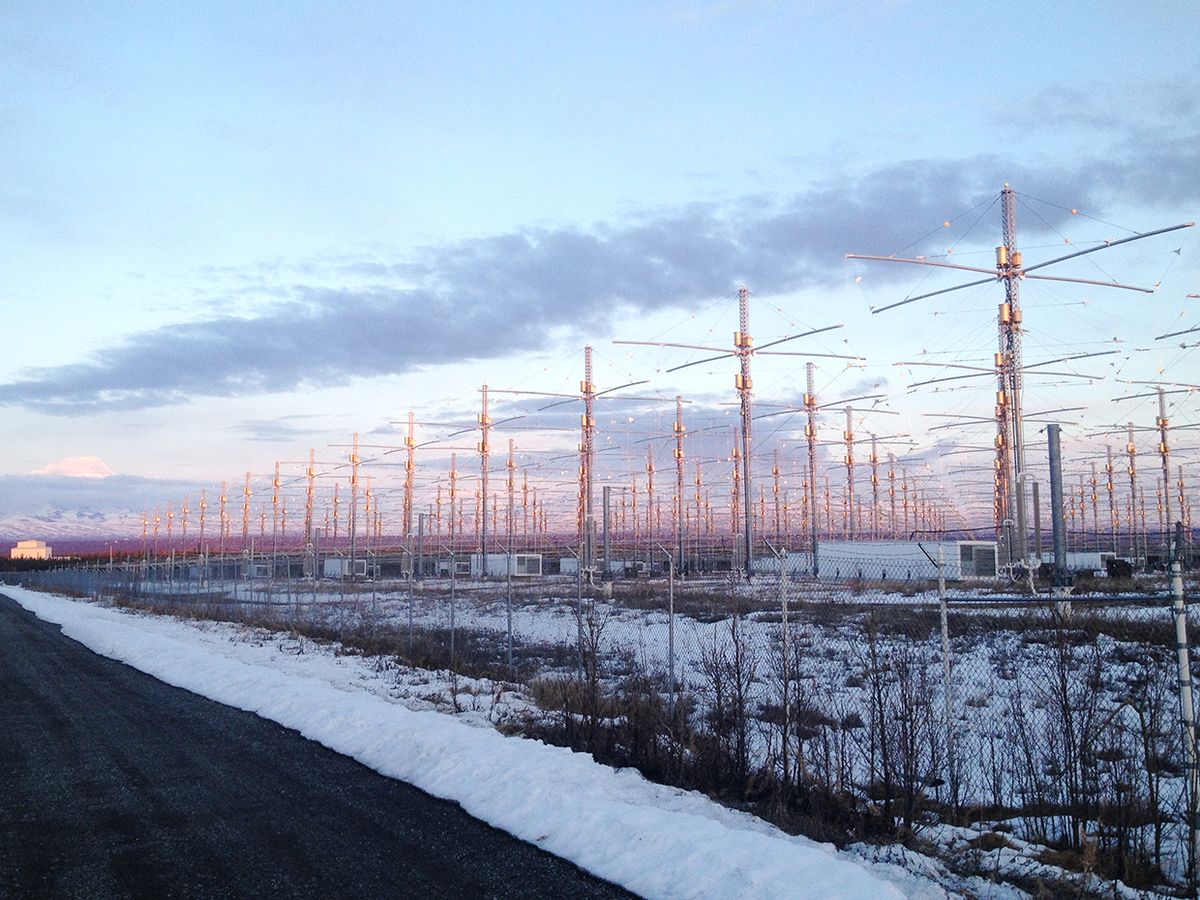 a-photo-of-the-harrp-antenna-array-lit-up-before-a-snowy-lanscape-at-sunset.jpg