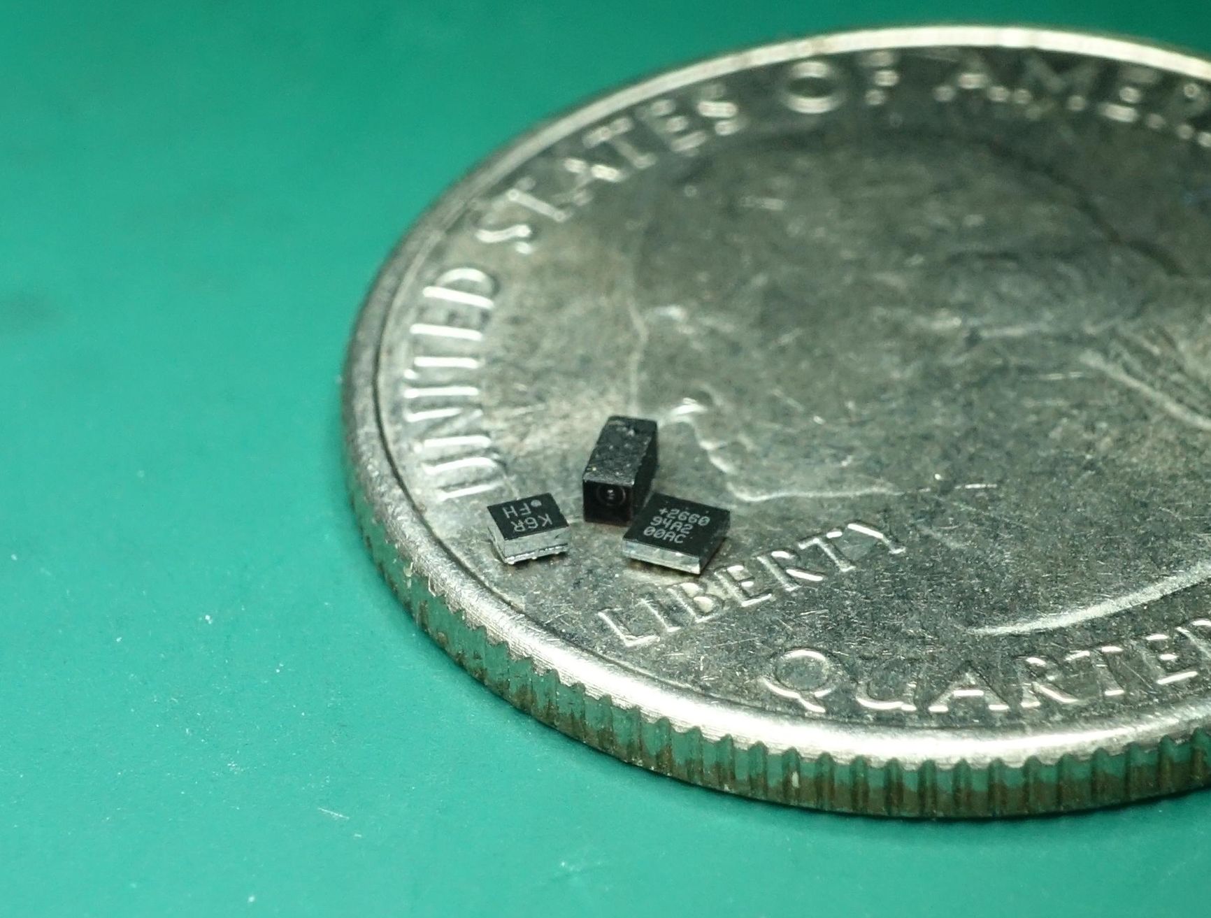 a-photo-of-three-tiny-black-electronic-c