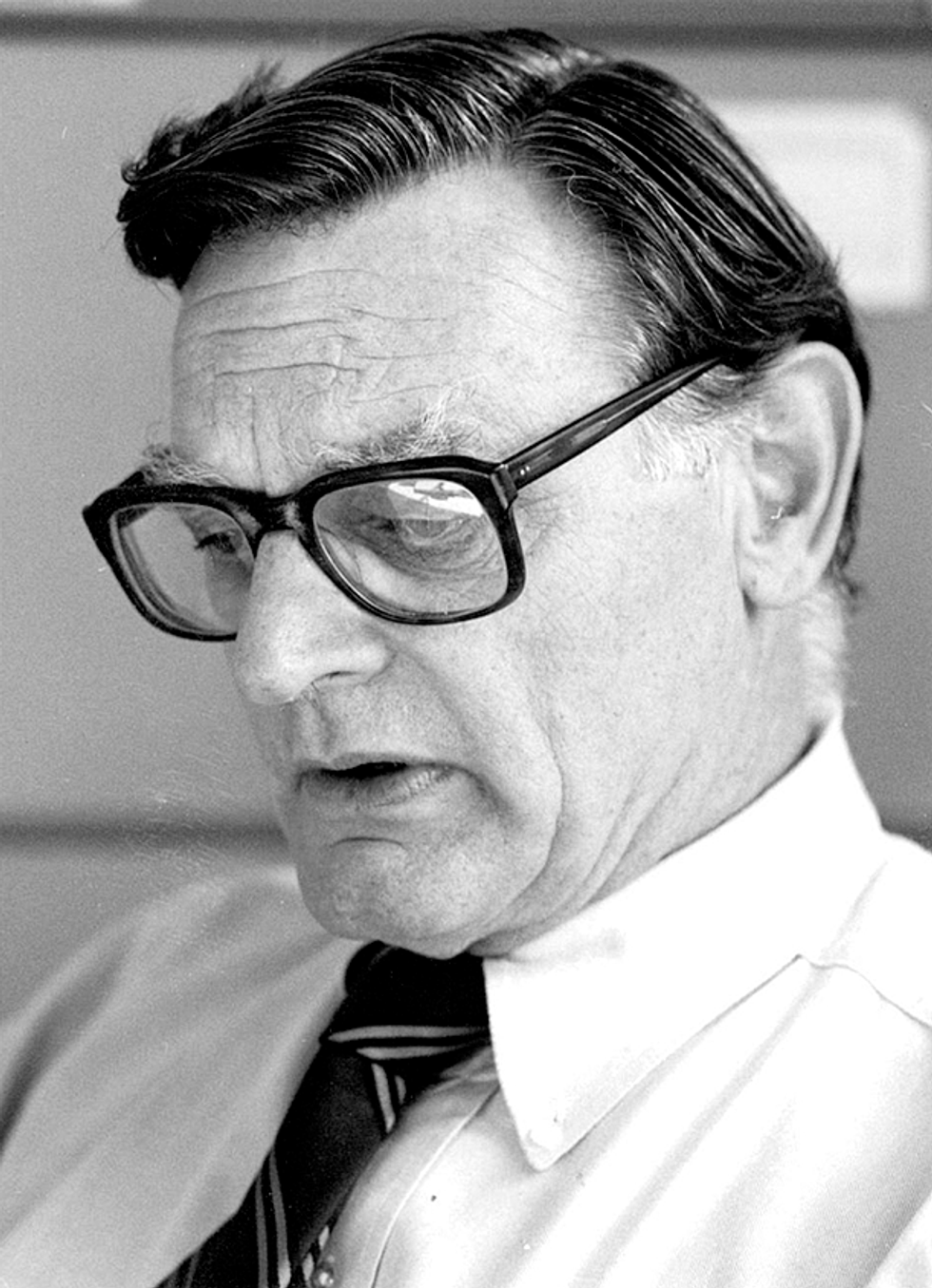 A photo that shows a closeup of a man with glasses