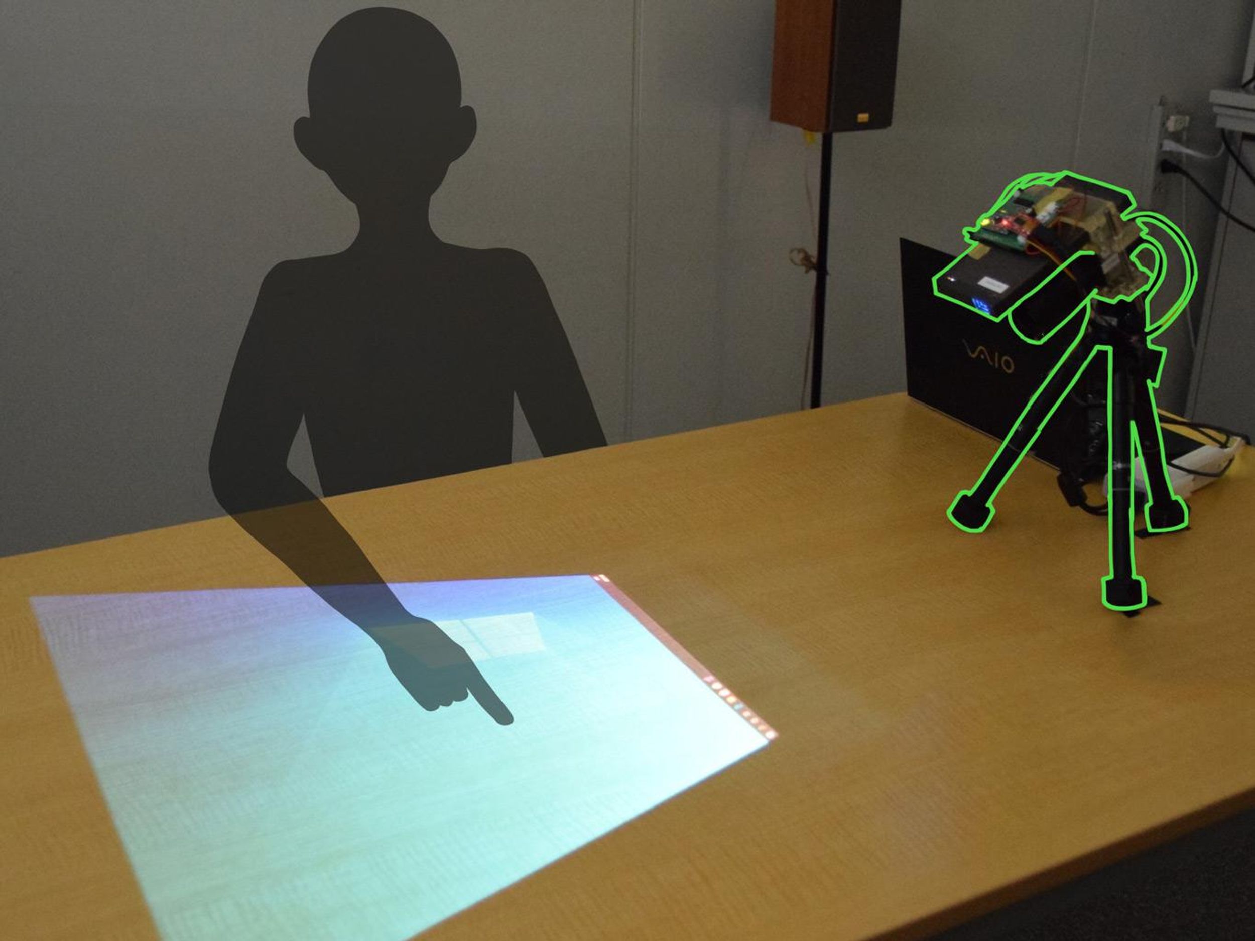 A projector-camera system that can display a touchscreen on any surface.
