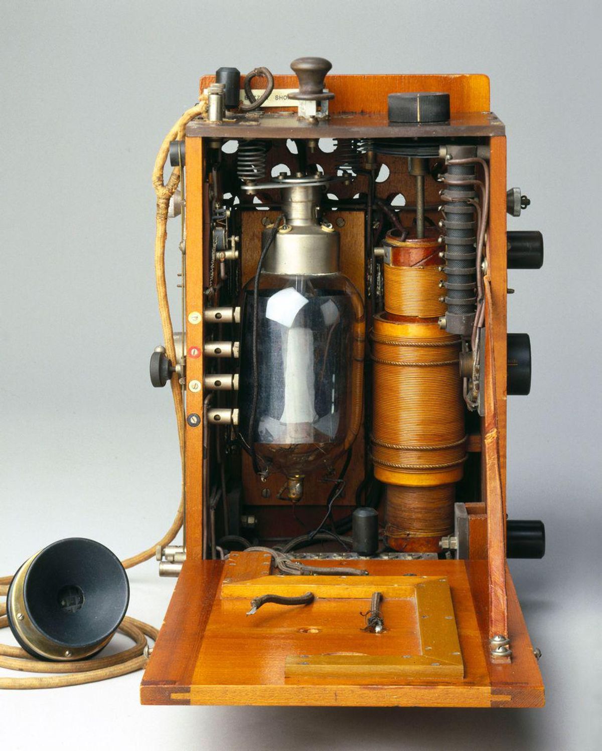 A radio telephony transmitter for use with aircraft, with a round valve and microphone. 
