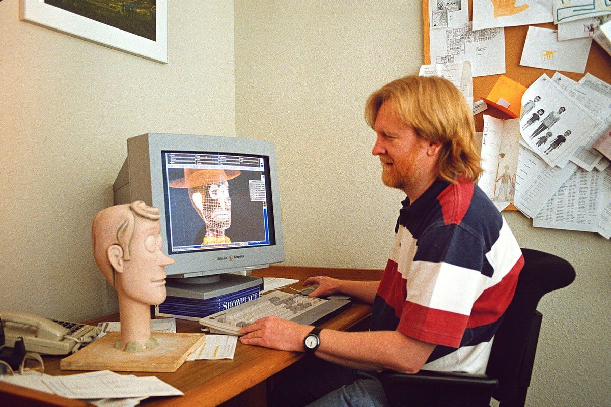 a-red-haired-man-sits-at-a-computer-with