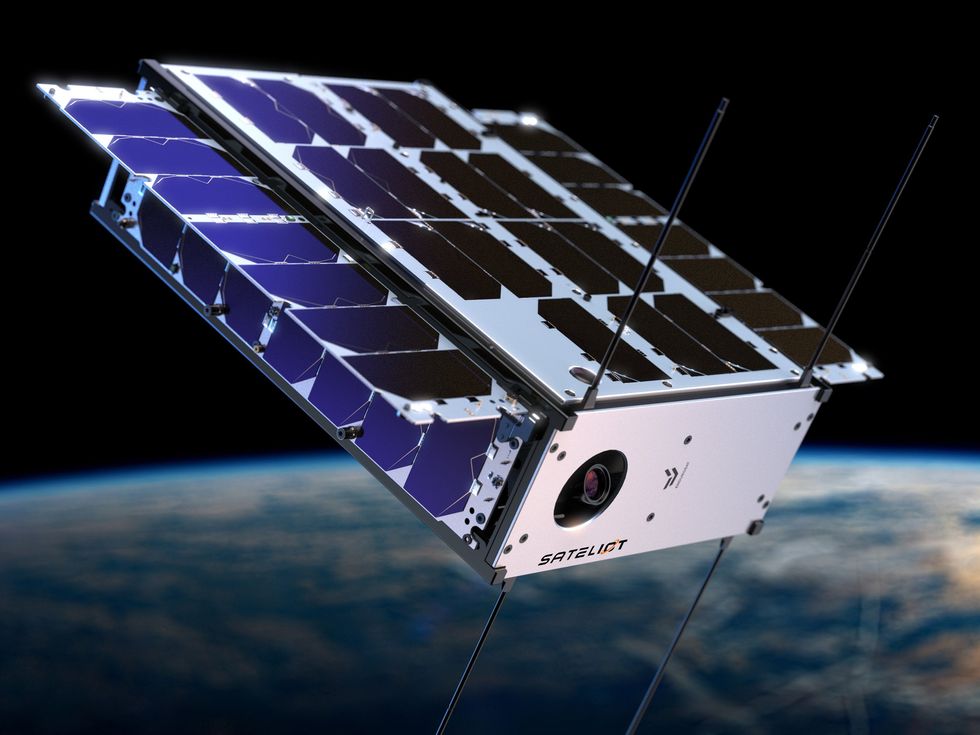 a rendering of a small rectangular satellite in orbit. The satellite is covered with blue panels and the front says "sateliot"