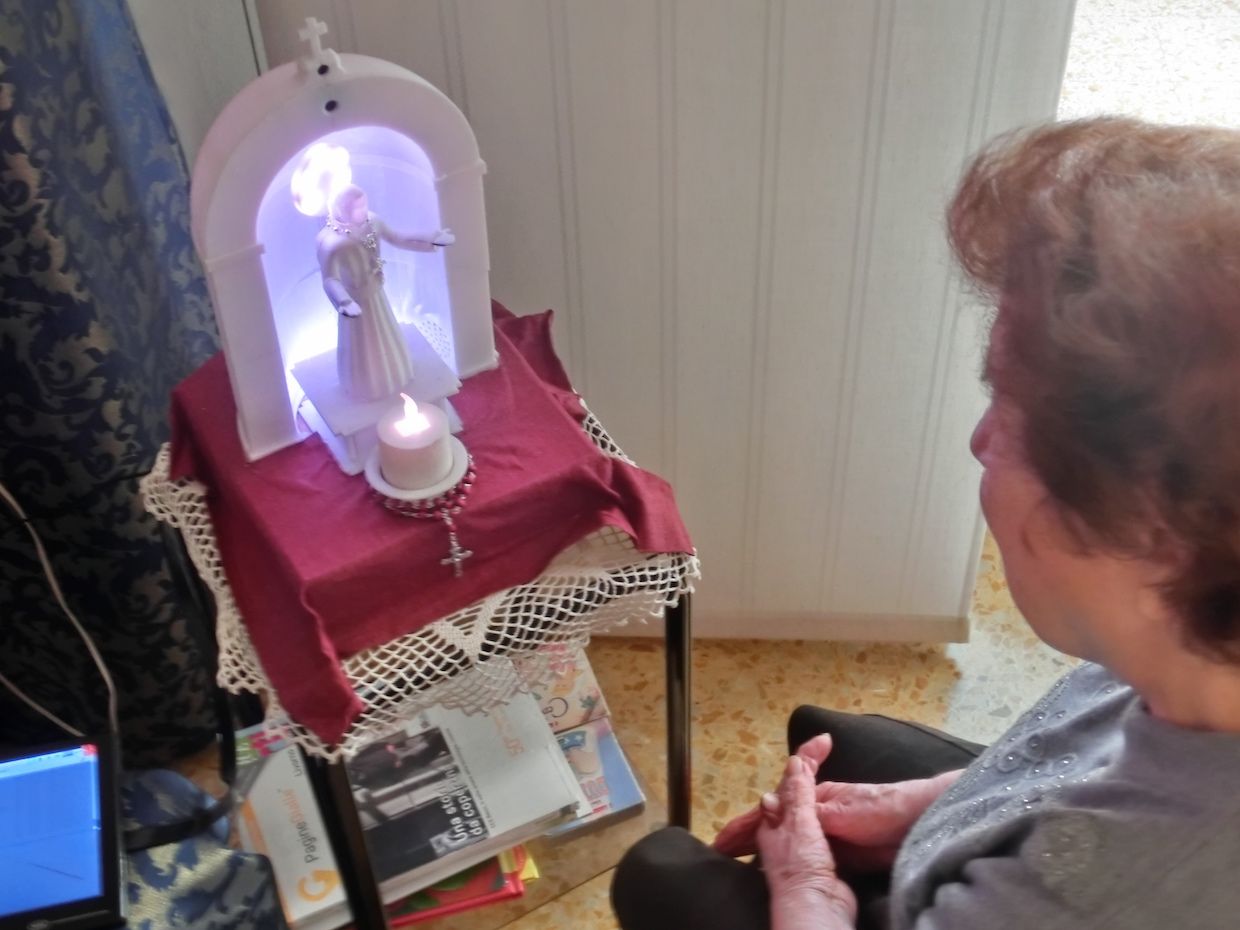 A robot with the appearance of a Christian Catholic saint can pray together with users and cite parts of the Bible and stories of the life of saints.