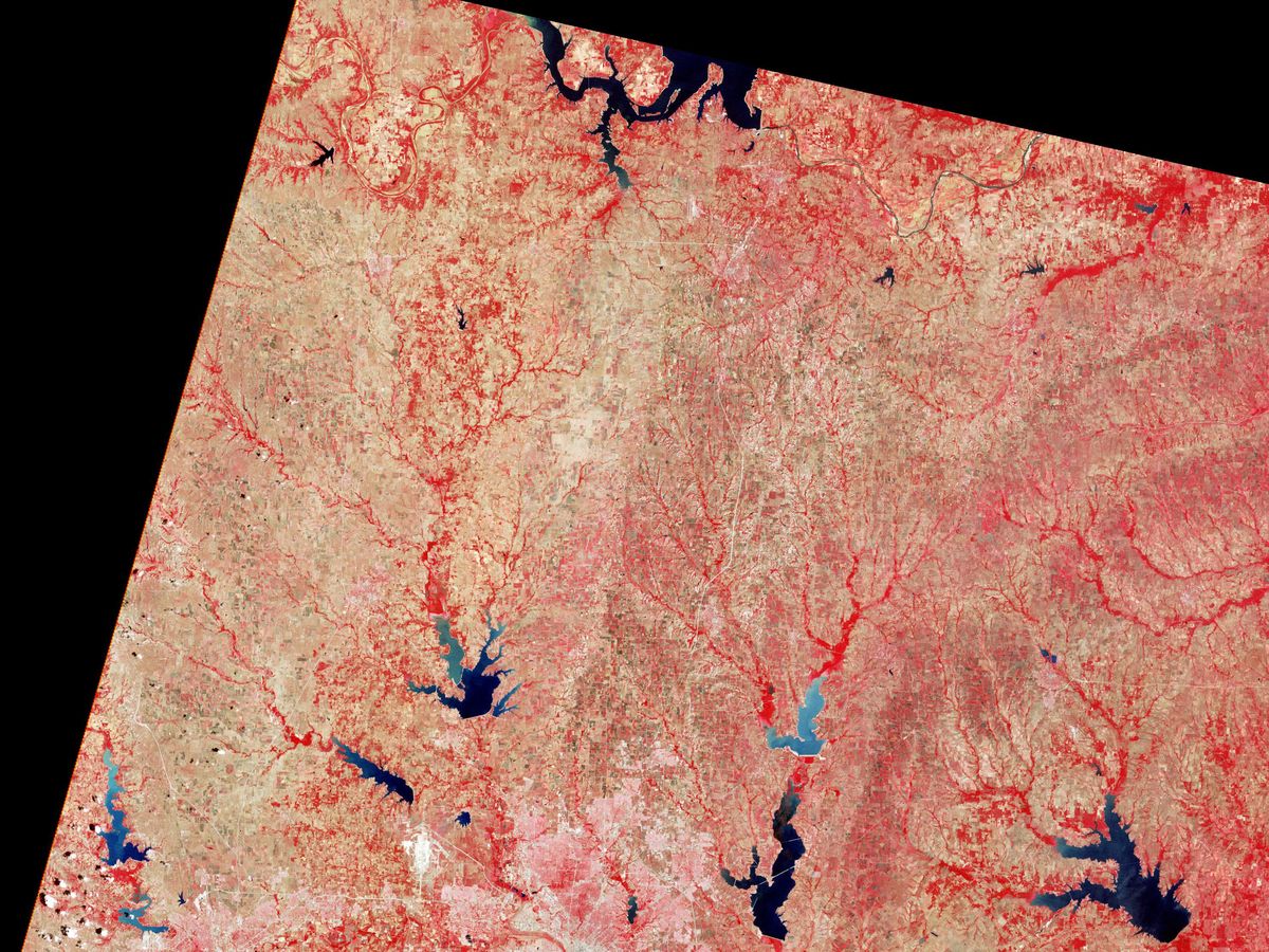 A satellite image shows vegetation in red tones and urban and rocky areas in grays and whites.
