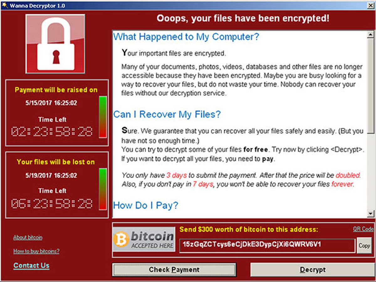 A screenshot of the WannaCry ransomware is a predominantly red window with several smaller windows with instructions for payment and two countdown clocks