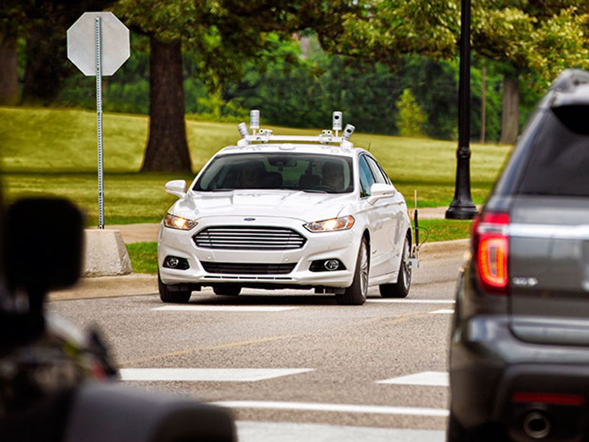 A self-driving Ford Fusion with lidar sensors on roof.