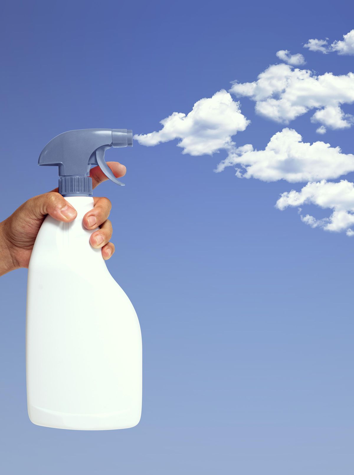 A spray bottle, spraying clouds out from the nozzle.