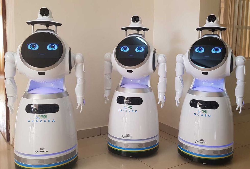 A squad of robots serves as the first line of defense against person-to-person transmission at a medical center in Kigali, Rwanda. 