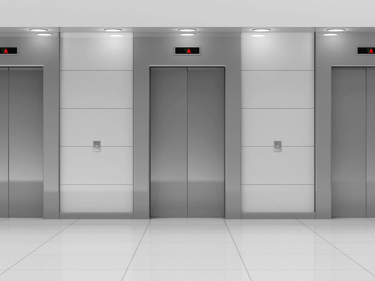 A stock photo if an empty modern looking elevator hall.