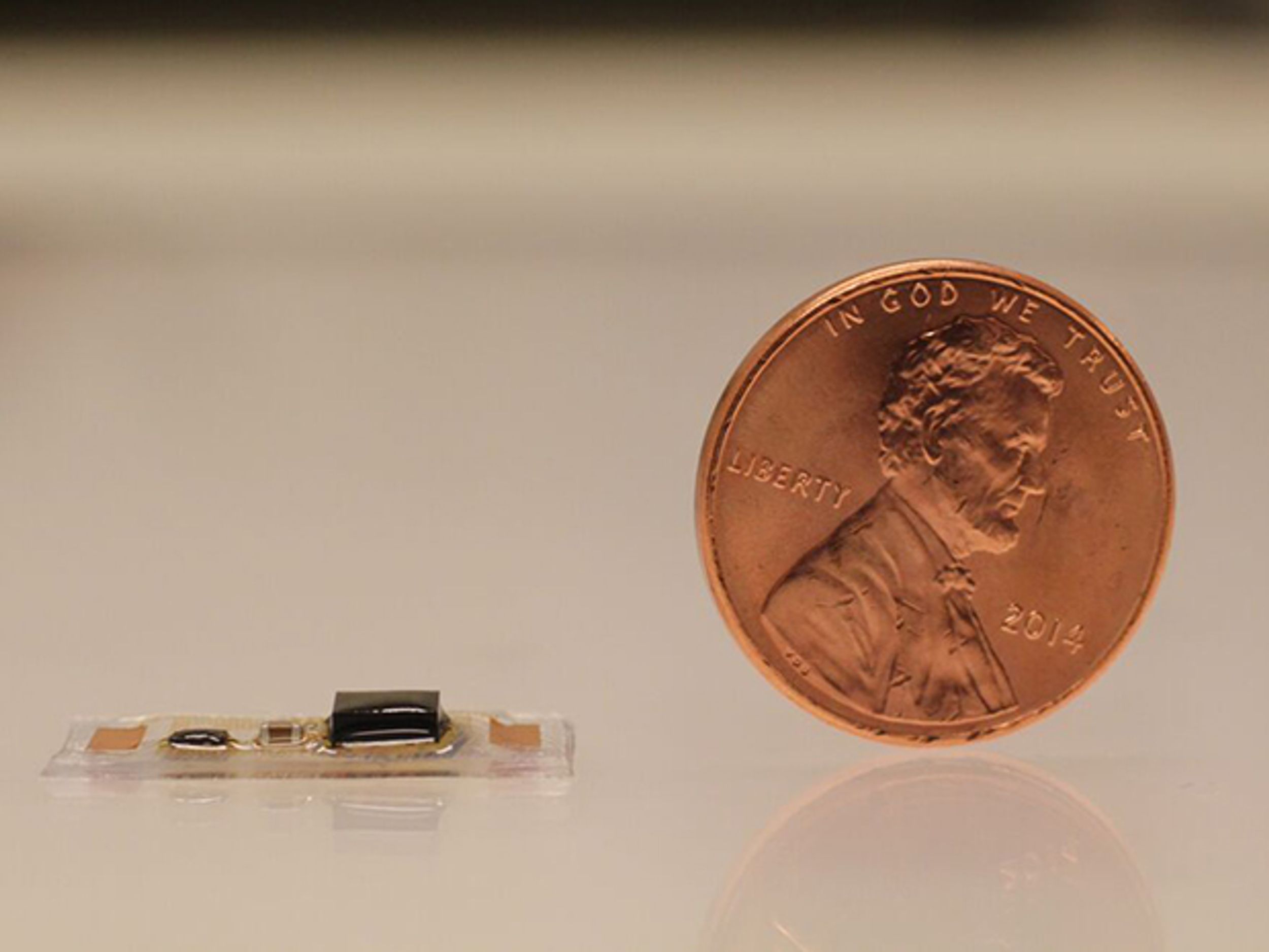 A tiny, wearable acoustic sensor developed by researchers can be used to monitor heart health and recognize spoken words.