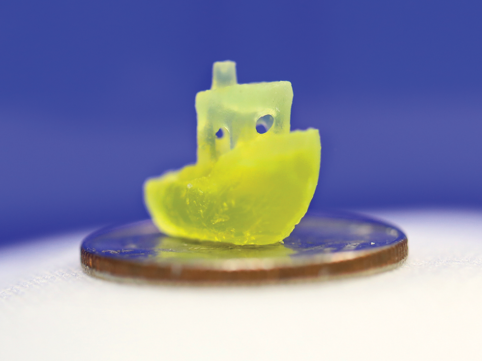 A translucent yellow boat sits on a dime