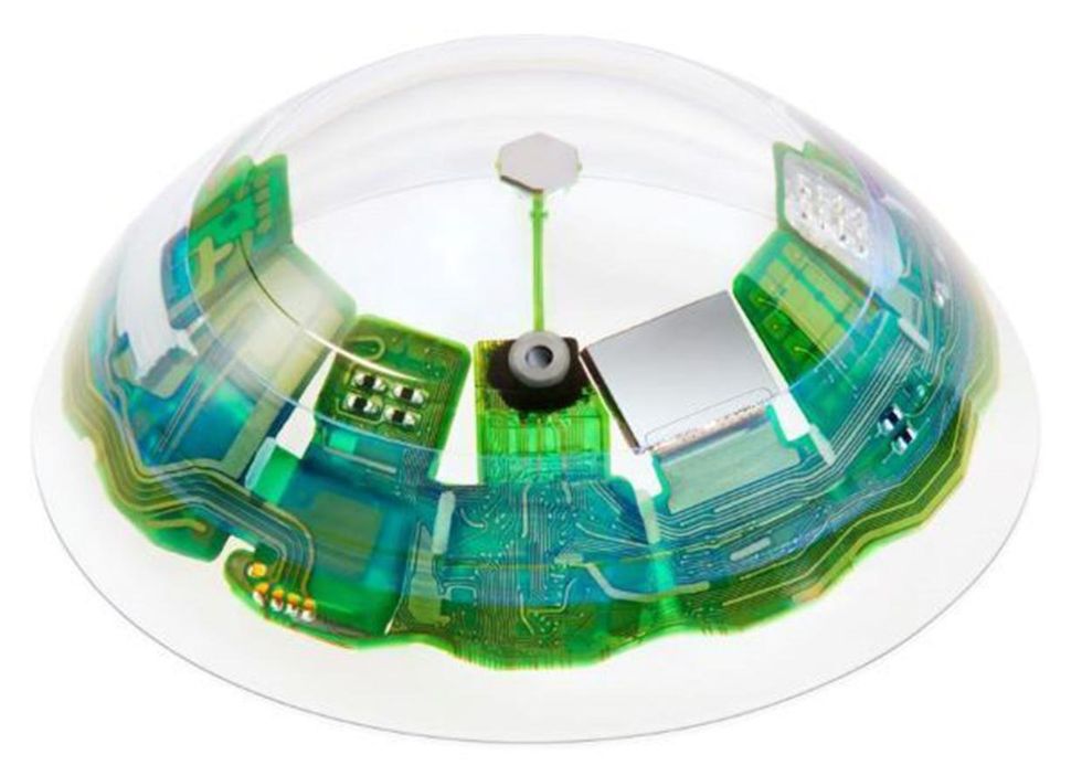A transparent contact lens showing computer chips and circuitry within its periphery