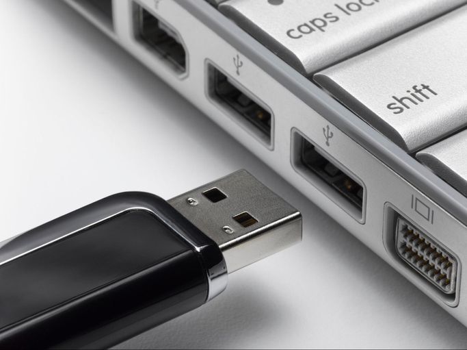A USB stick about to be connected to a computer