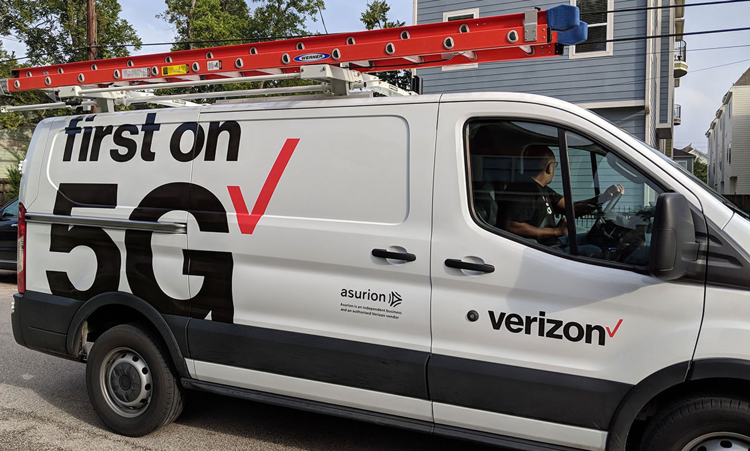A Verizon truck heading to roll out 5G for the home.