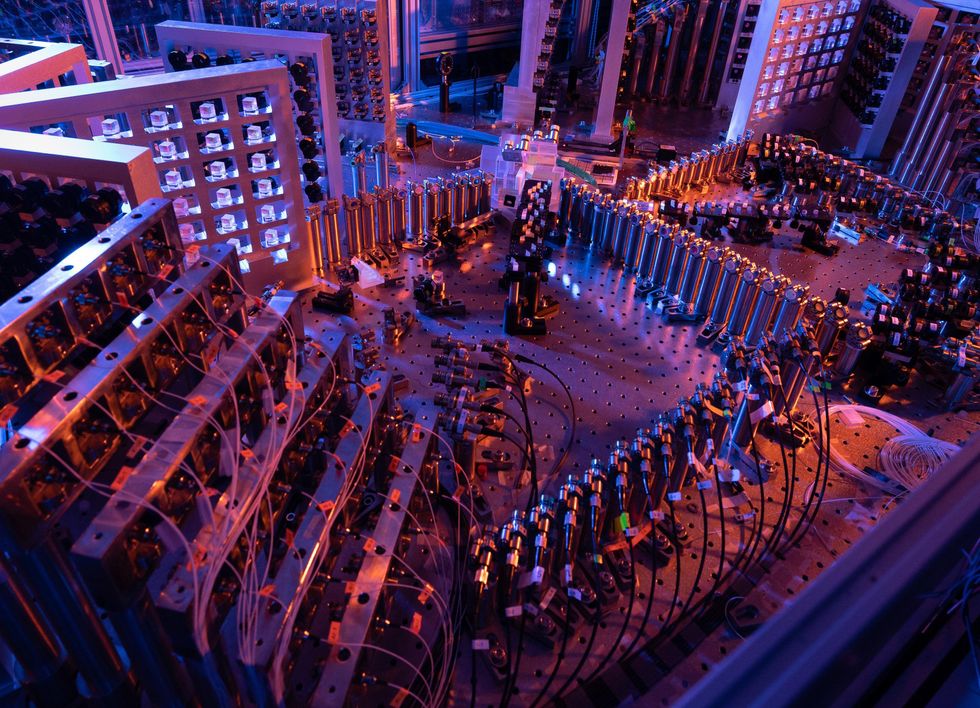 A view of the inside of a quantum computer, with electronic components arranged on giant peg boards