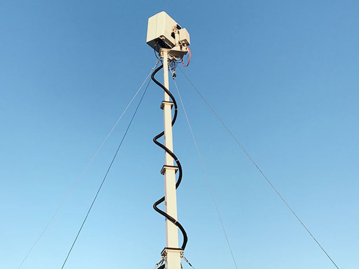 A white Starry Beam antenna mounted on a pole for a beta test in Boston, Massachusetts