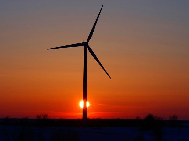 A wind turbine at sunset.