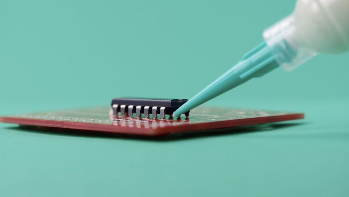 Adhesive staking of DIP component on a circuit board using Master Bond EP17HTDA-1.