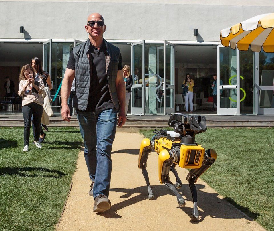 Amazon CEO Jeff Bezos with Boston Dynamics' SpotMini robot
