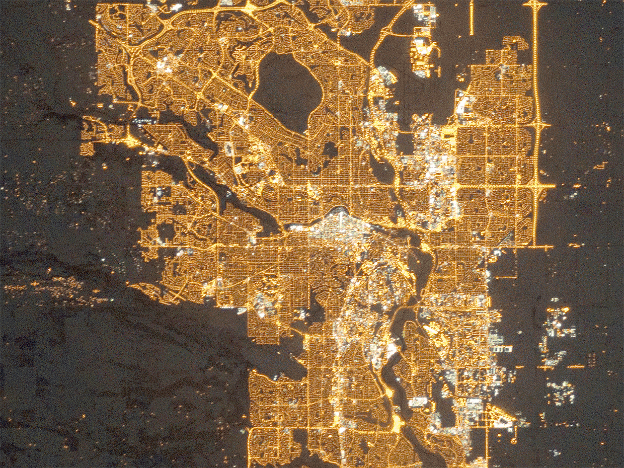 An animated gif shows changes in outdoor lighting in Calgary, Alberta, Canada as seen from the International Space Station in 2010 and 2015.