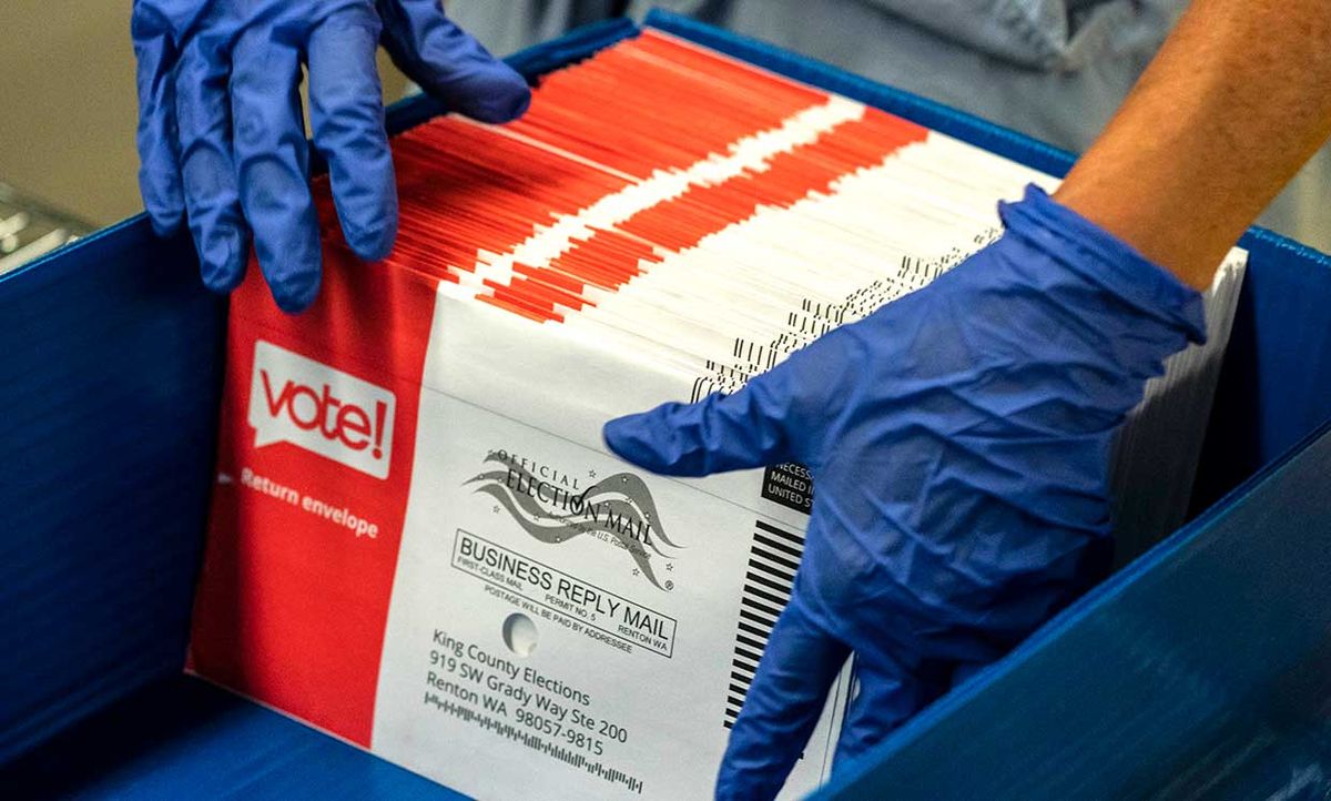 An elections worker sorts unopened ballots at the King County Elections headquarters on August 4, 2020 in Renton, Washington. Today is election day for the primary in Washington state, where voting is done almost exclusively by mail.