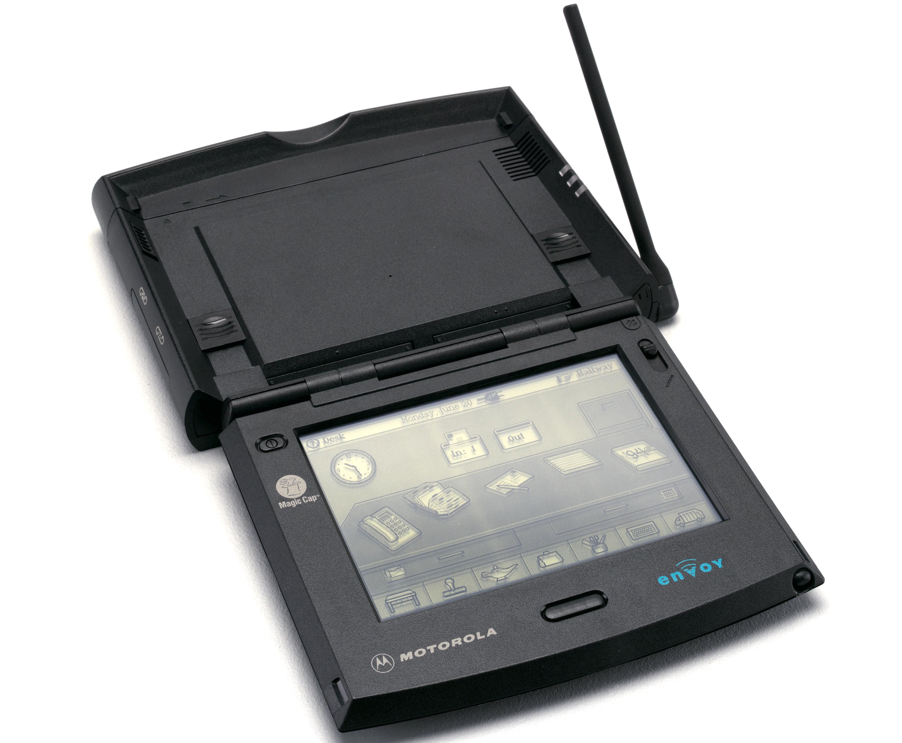 An electronic communication device with a black and white screen and antenna. The words Motorola and Envoy are printed on the device.
