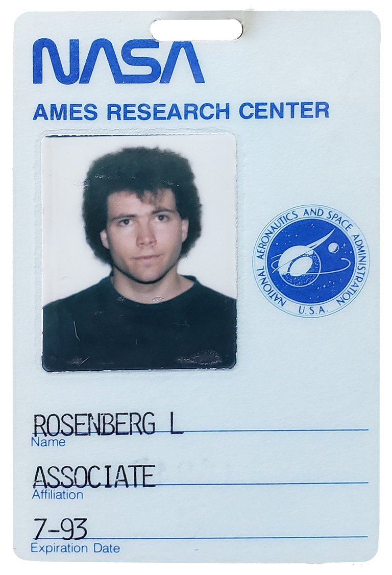 An employee badge with a photo of a man and logo of NASA. Text on badge reads Ames Research Center