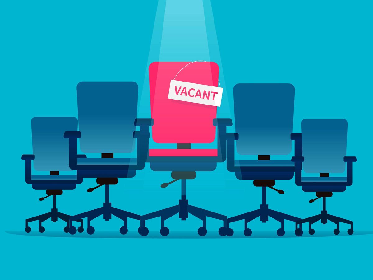 An illustration of a row of blue office chairs with a red one in the middle labeled “VACANT.”