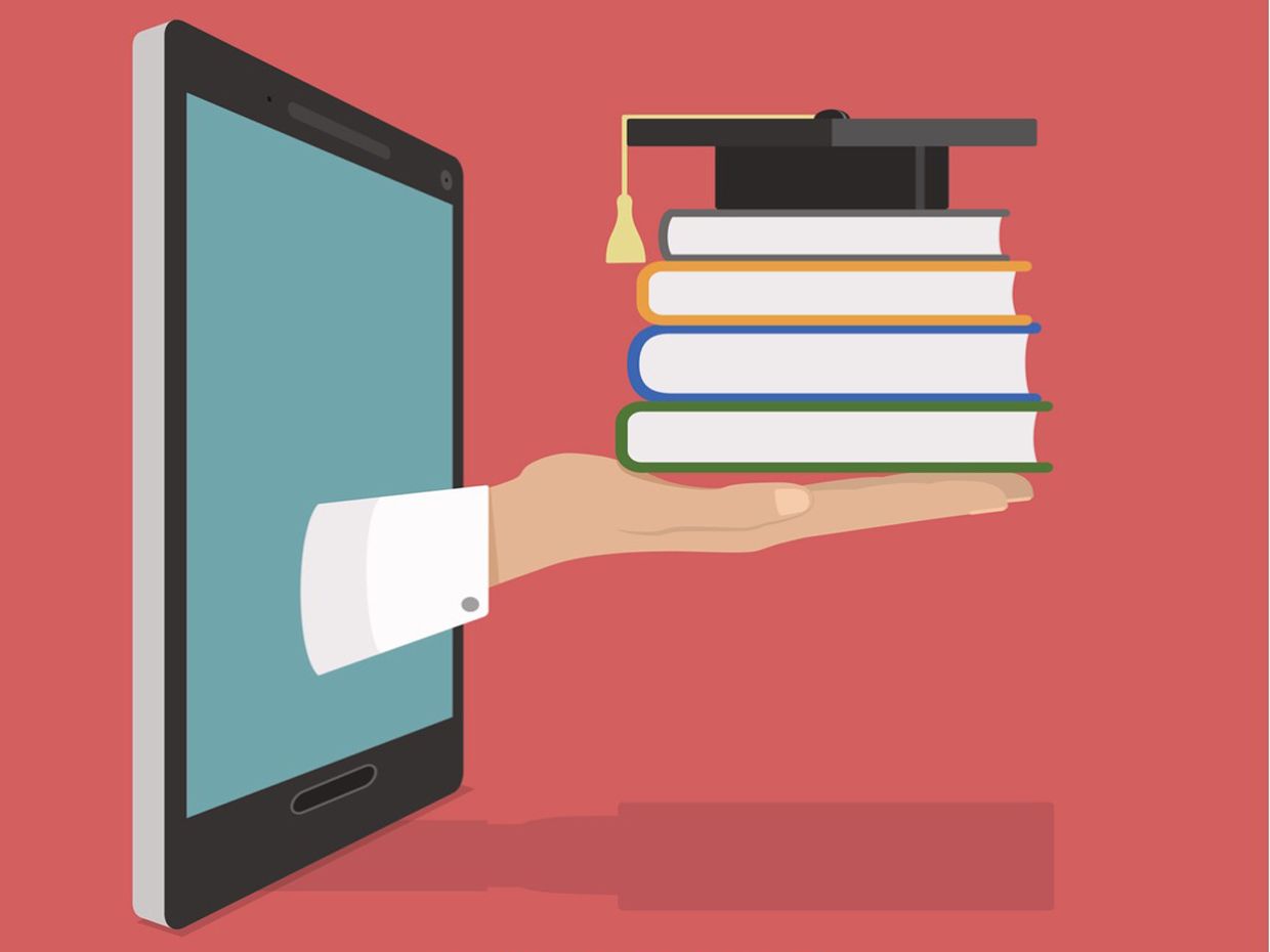 An illustration shows a hand holding a stack of books sticking out of a computer.