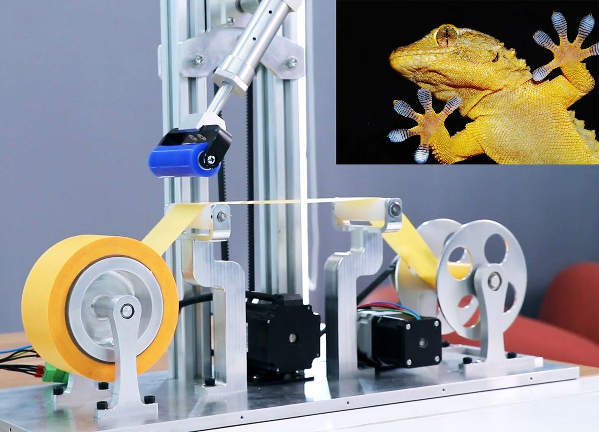 An image of a reel to reel of yellow tape, with a blue cylinder on a robotic arm approaching it. There is an inset of a gecko in the top right, with it's ten toes sticking to a clear surface.