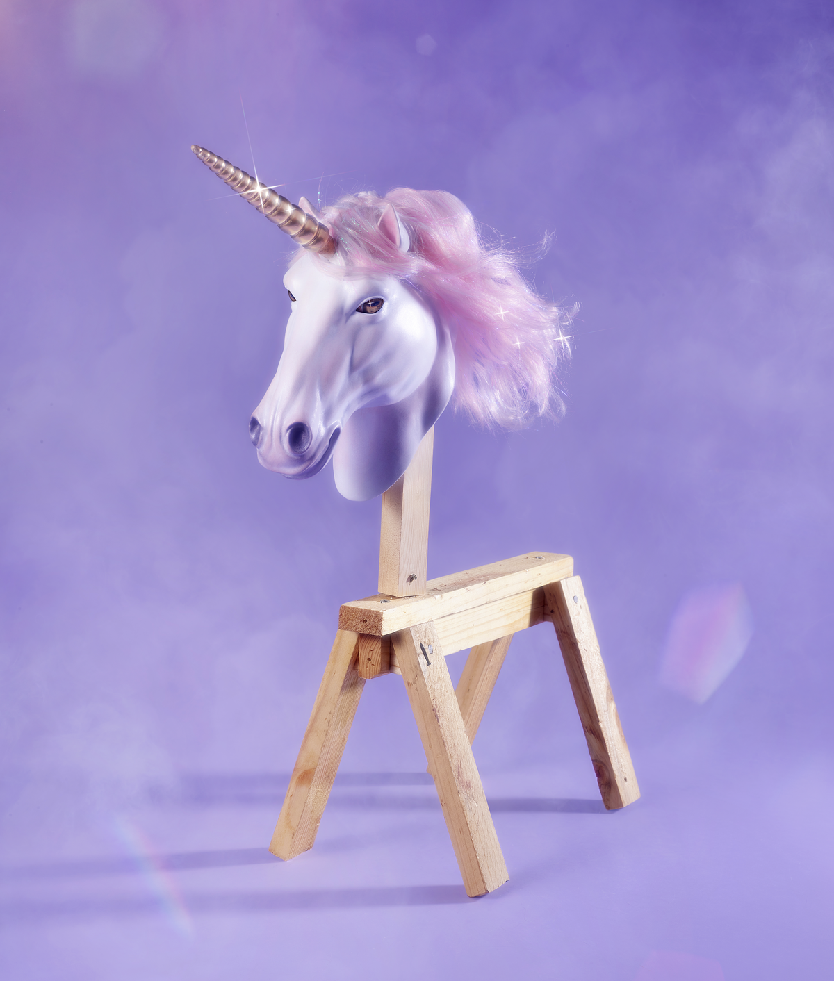 An image of a sawhorse with a unicorn head on it.  