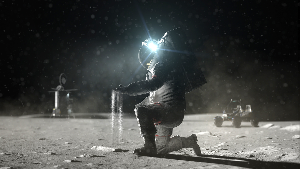 An image of an astronaut having moon soil fall from his hand.