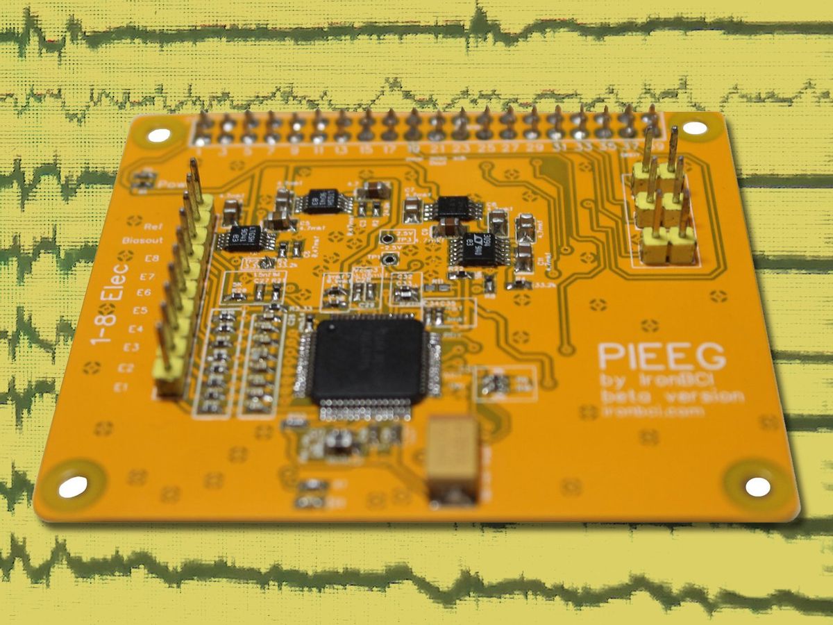 An orange circuit board labelled PIEEG superimposed on a background showing brain waves