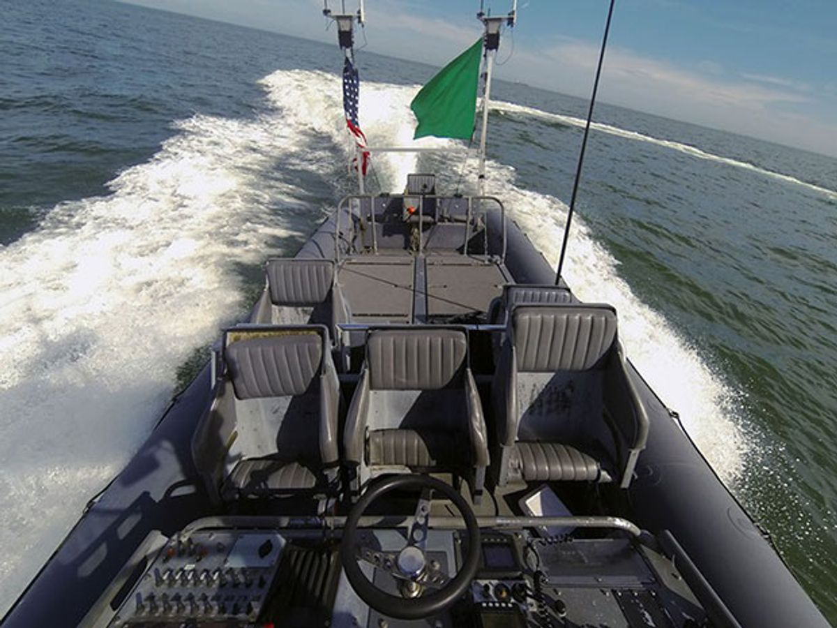 An unmanned rigid-hull inflatable boat operates autonomously during an Office of Naval Research (ONR)-sponsored demonstration of swarmboat technology held at Joint Expeditionary Base Little Creek-Fort Story.