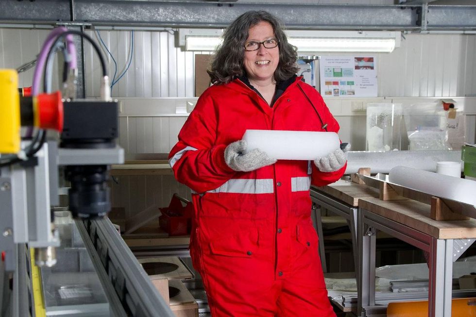 Angelika Humbert holds a core sample of glacier ice.