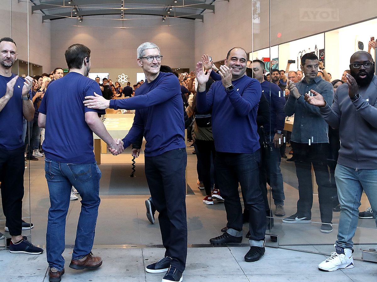 Apple CEO Tim Cook greets customers with employees at an Apple Store on November 3, 2017 in Palo Alto, California.