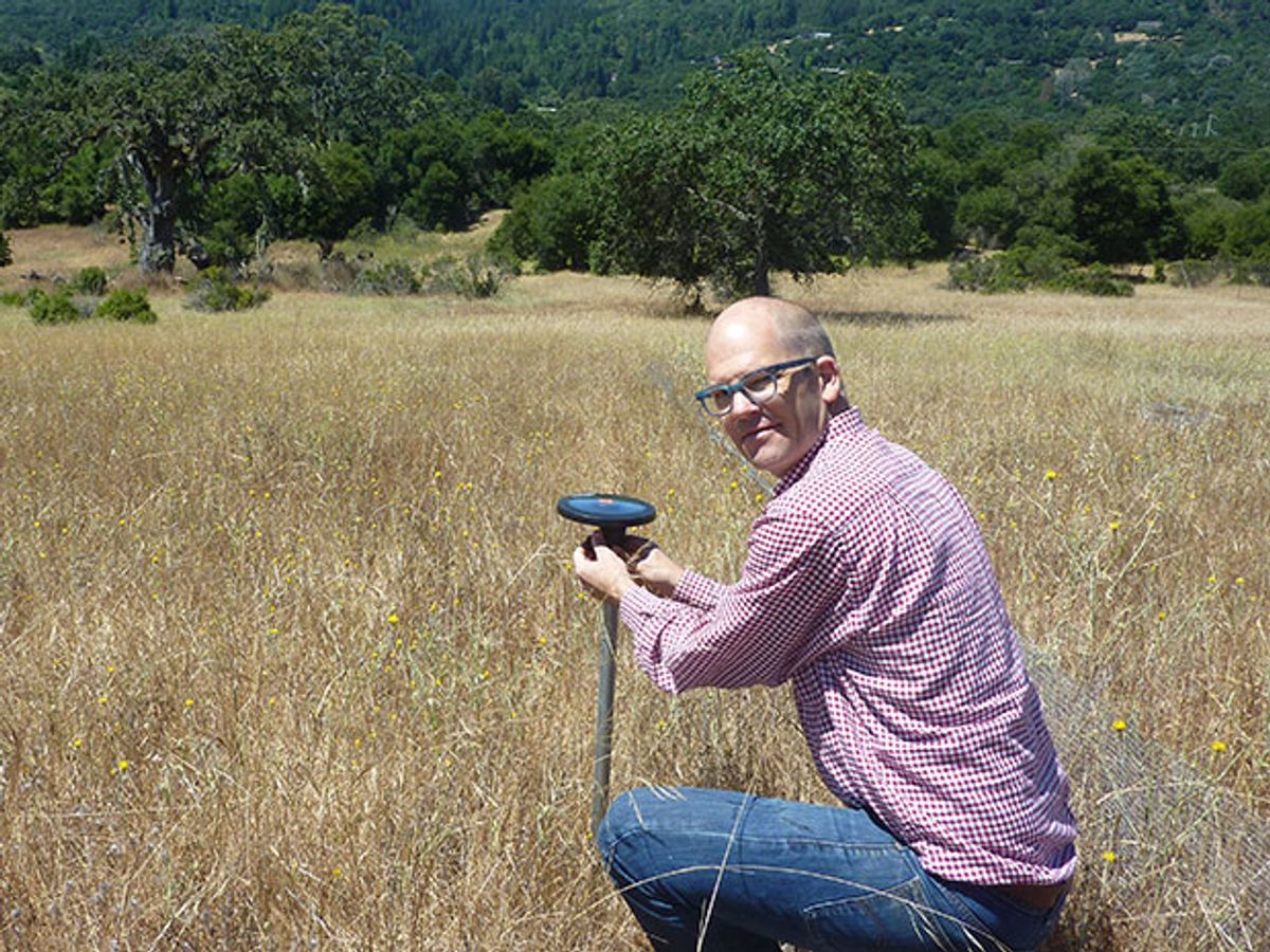 Arable founder Adam Wolf with his plant- and environment-monitoring Internet of Things device