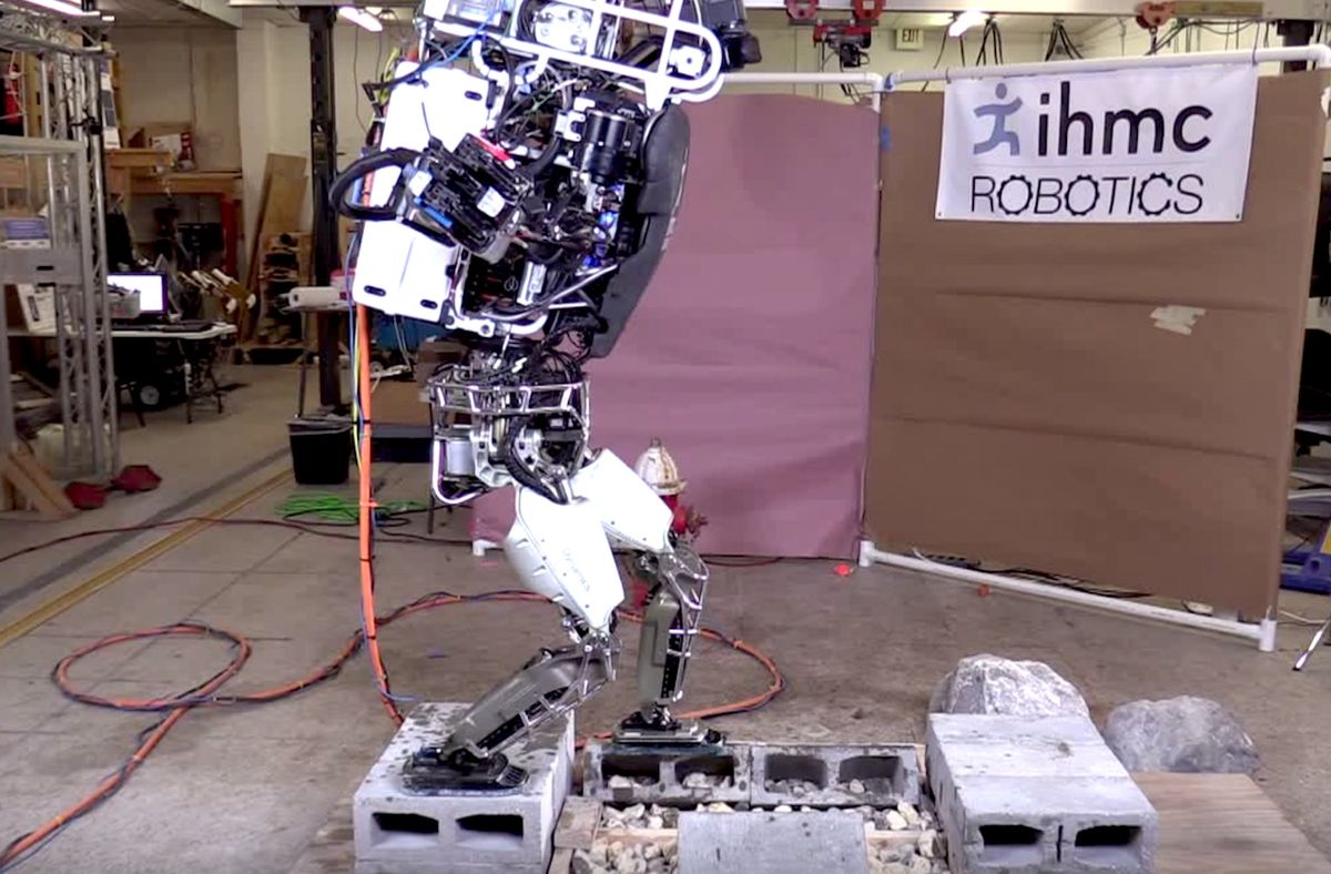 Atlas humanoid robot walking on cinder blocks
