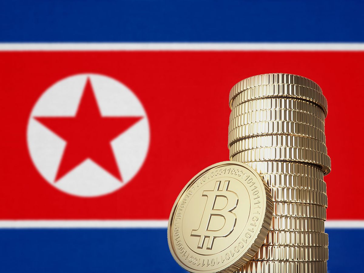 Bitcoins in front of a North Korea flag