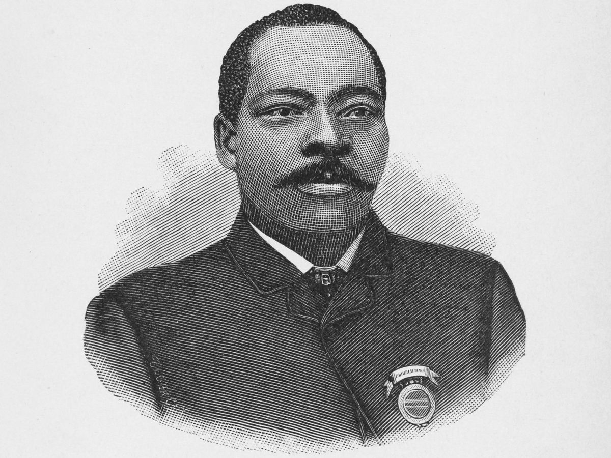 Black and white illustration of a man with a moustache