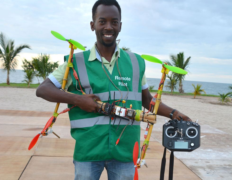Bornlove Ntikha holding his DIY drone.