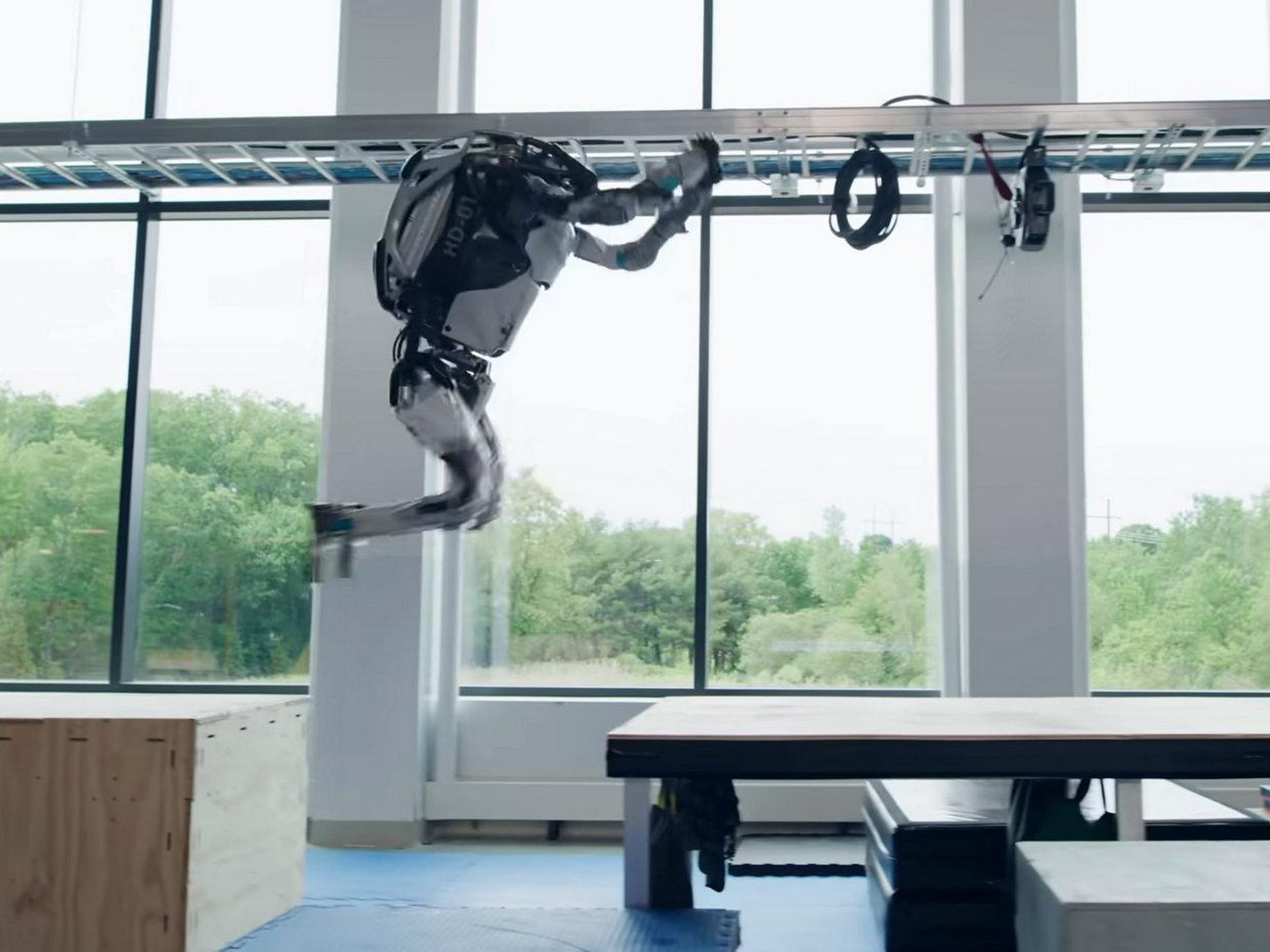 Boston Dynamics Atlas robot jumping across a gap