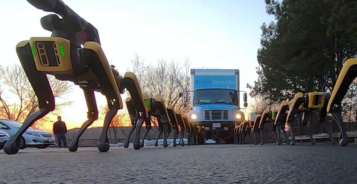 Boston Dynamics' Spot robots pull a truck