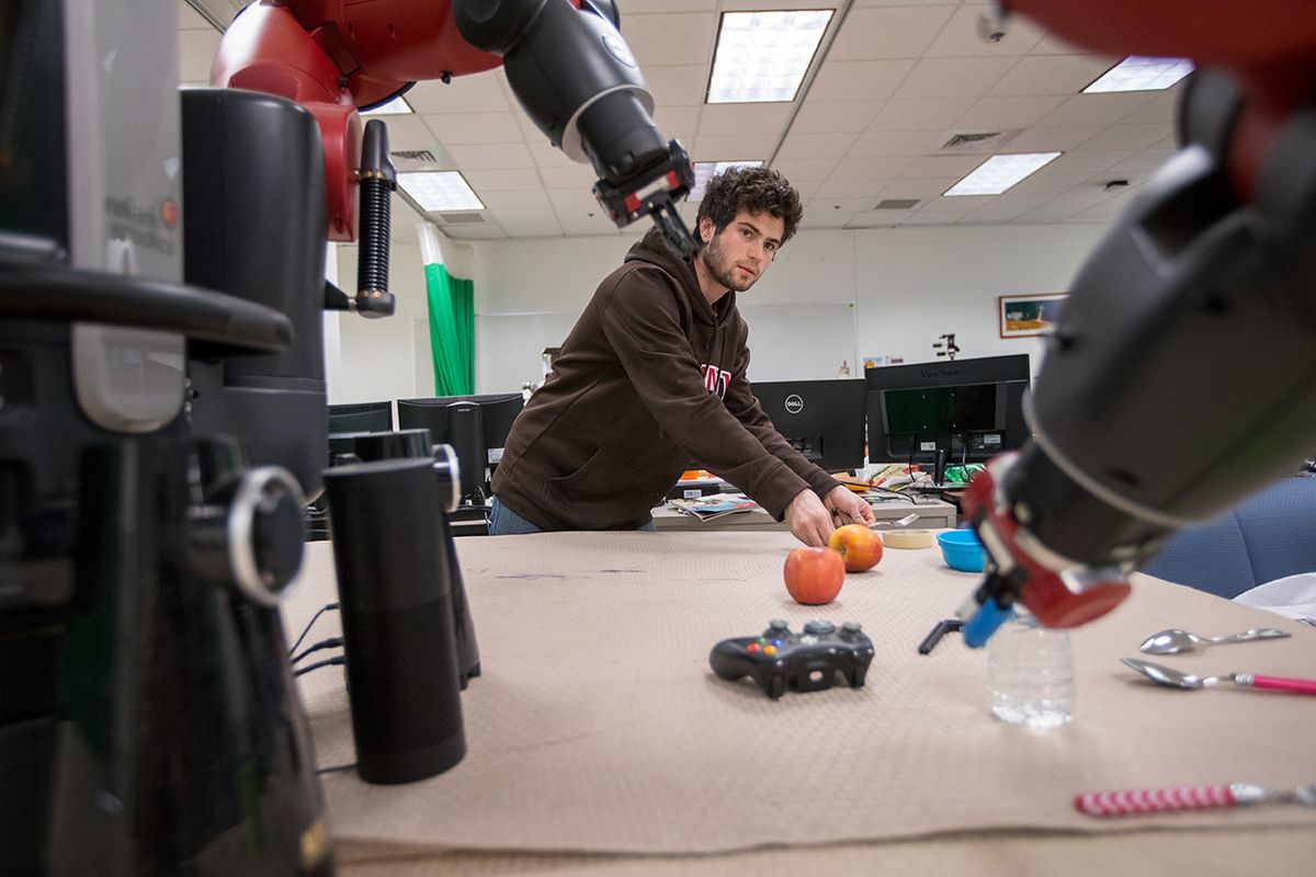 Brown University researcher works with a Baxter robot.