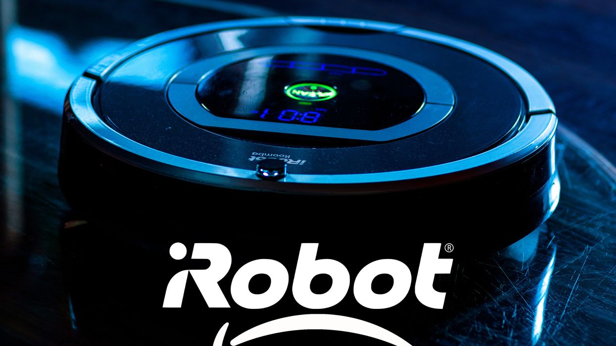 circle-robot-vacuum-against-a-blue-backg